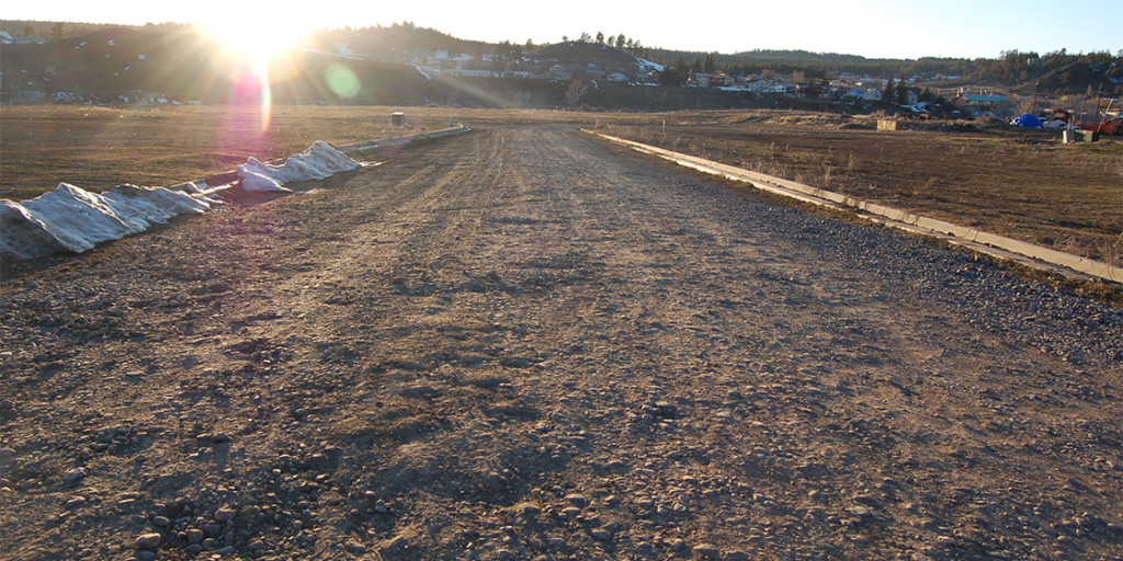 A un-improved gravel road leads onto the 27-acre parcel owned by the Springs Partners LLC. Owners Matt Mees and Bill Dawson thought they had sold the property to the Whittington family in 2005, but the Whittingtons handed the parcel back to them in 2012. Mees and Dawson now claim to need Town taxpayers to build them a bridge onto the property.