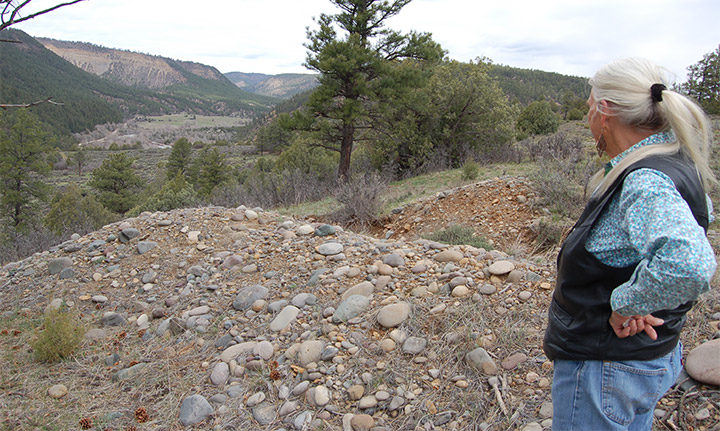 Lee Constant, surveying a test hole on her 320-acre property near Trujillo, Colorado.