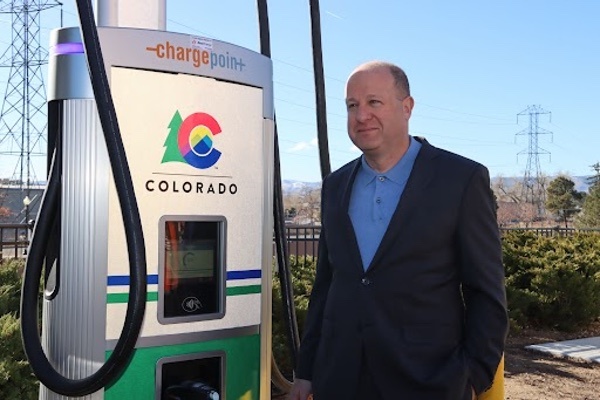 Governor Polis standing next to ChargePoint Charger at Target Wheat Ridge