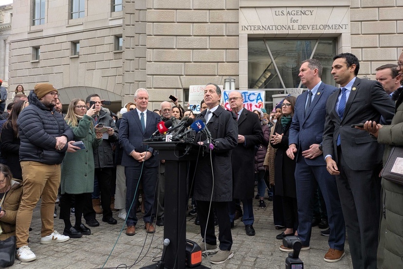 Sen. Chris Van Hollen, left, D-Md., and Rep. Jamie Raskin, D-Md., right, speak to a crowd gathered at the shuttered Washington, D.C., headquarters of the U.S. Agency for International Development on February 3, 2025 after being refused entry to the building. (Photo by Ashley Murray/States Newsroom)