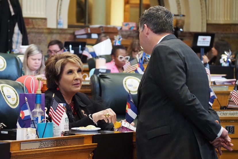 Colorado House Majority Leader Monica Duran speaks with Rep. Alex Valdez on the House floor during the last day of the 2025 legislative session on May 7, 2025 at the Colorado Capitol. (Lindsey Toomer/Colorado Newsline)