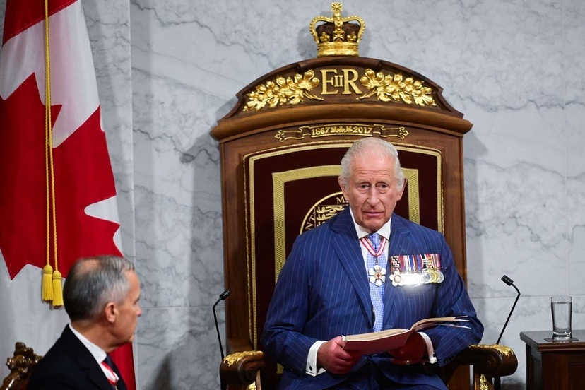 King Charles III reads the Speech from the Throne on May 27, to open a new session of the Canadian Parliament, as new Prime Minister Mark Carney looks on.